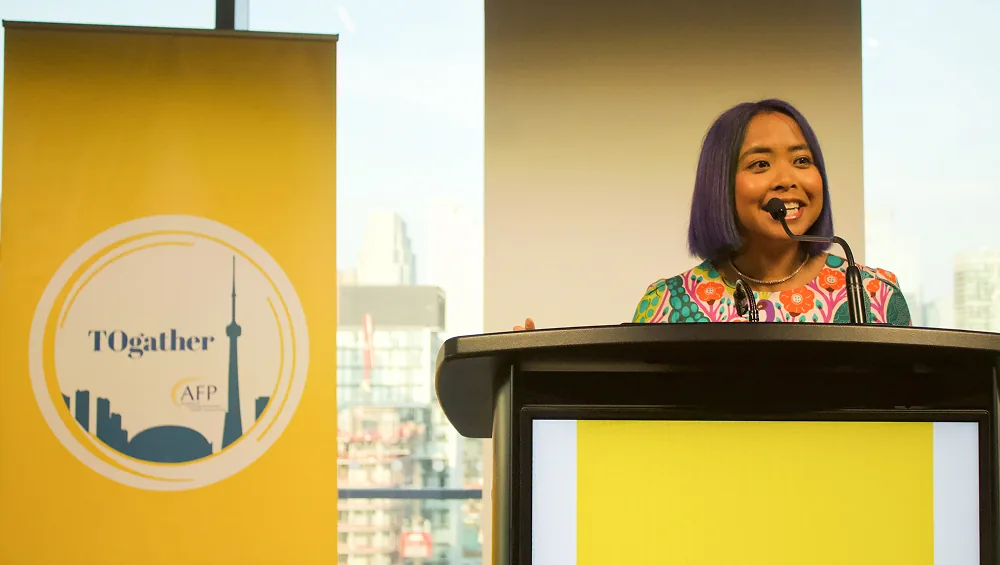 Erika Casupanan delivering a keynote at the AFP Toronto Togather Conference