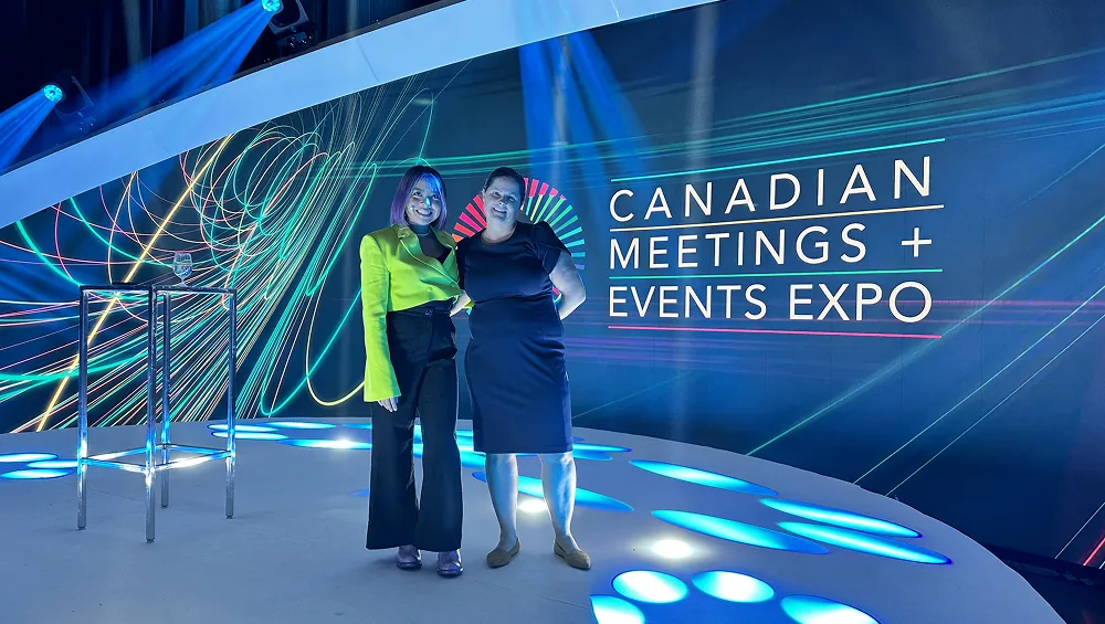 Erika Casupanan and Tami Adams on stage at CMEE