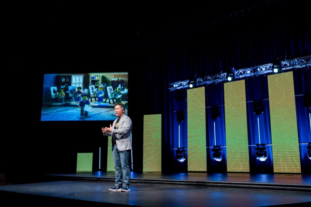 Leo Chan delivering a keynote on stage