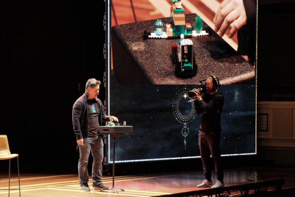Leo Chan facilitating a LEGO® SERIOUS PLAY® session on stage